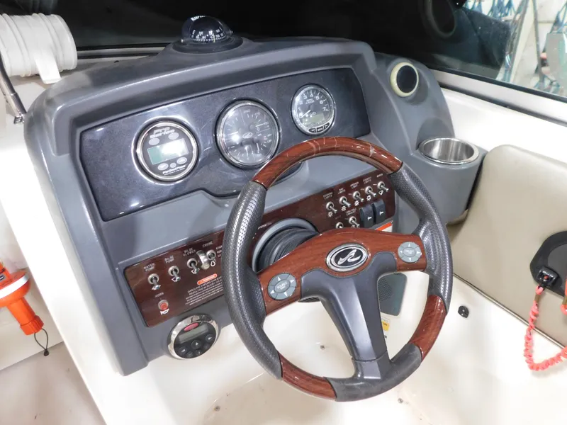 Slide: The Image of Steering wheel and dashboard of 2007 Sea Ray 260 Sundeck boat. - 12