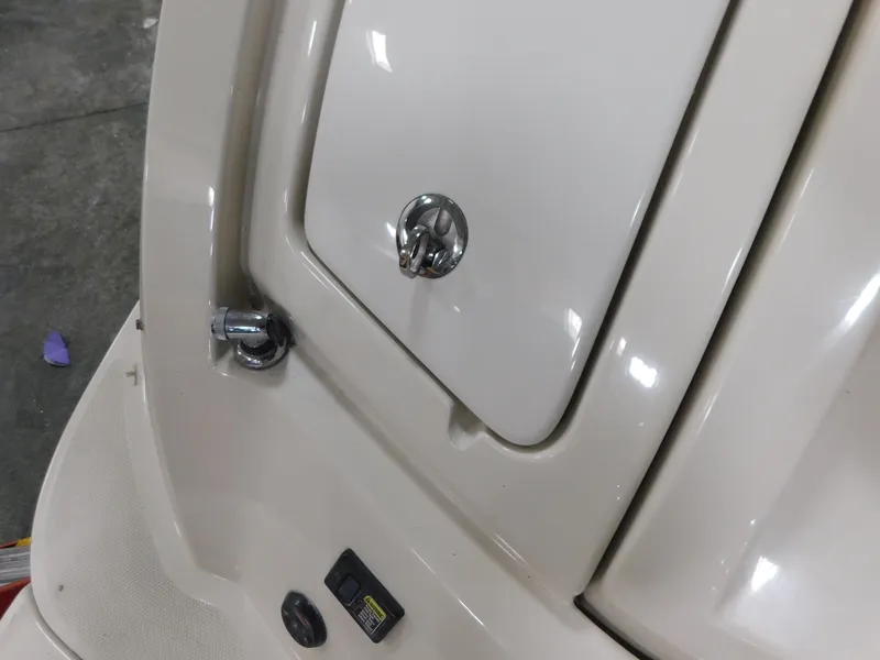 Slide: The Image of 2007 Sea Ray 260 Sundeck boat compartment with chrome handle and latch. - 15