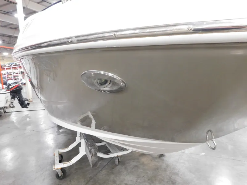 Slide: The Image of 2007 Sea Ray 260 Sundeck boat in a showroom on a trailer. - 16