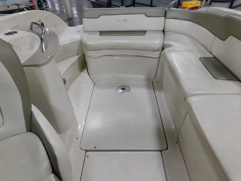 Slide: The Image of 2007 Sea Ray 260 Sundeck interior with seating and sink. - 5