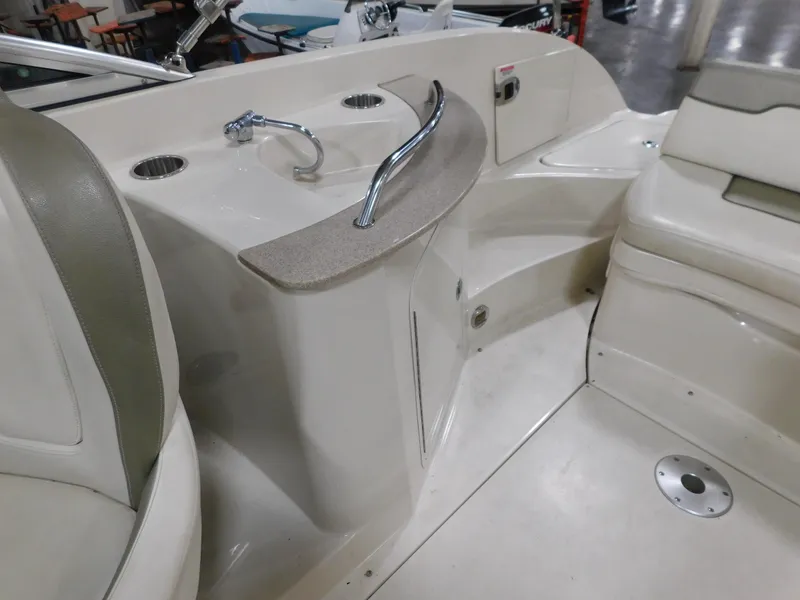 Slide: The Image of 2007 Sea Ray 260 Sundeck interior with seating and sink area. - 6