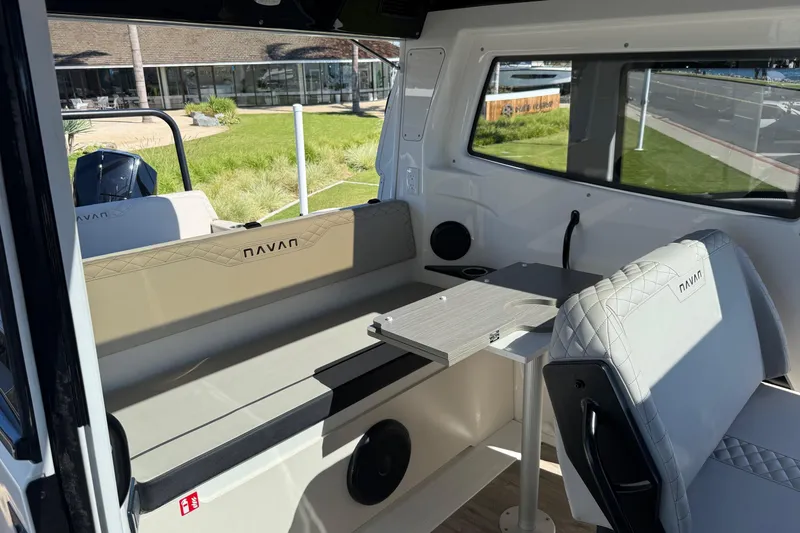 Slide: The Image of Interior of 2025 Navan C30 boat with seating and table, showcasing modern design. - 13