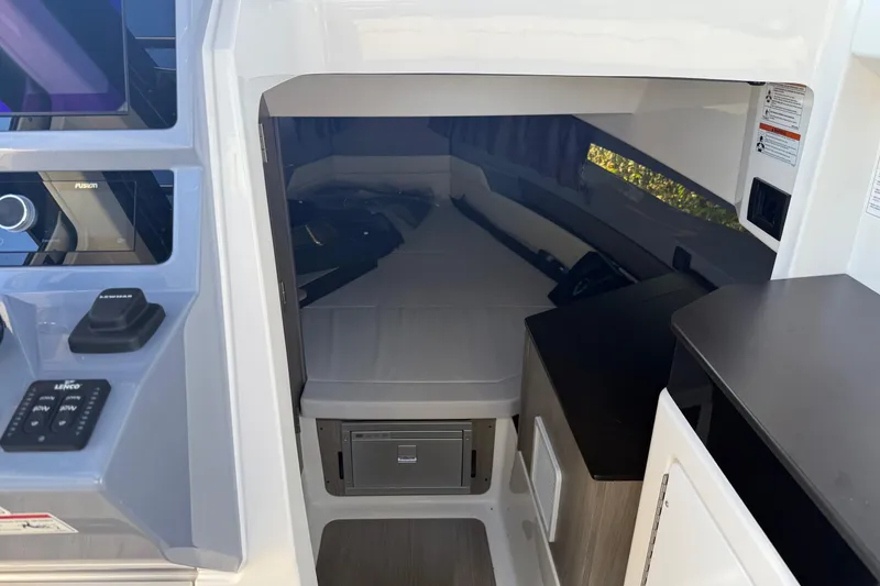 Slide: The Image of Interior cabin of 2025 Navan C30 boat with modern controls and sleeping area. - 15