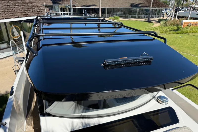Slide: The Image of Sleek black roof of 2025 Navan C30 boat with mounted light bar. - 18