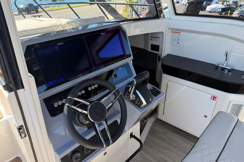 Slide: The Image of Interior of 2025 Navan C30 boat with modern steering and control panel. - 9