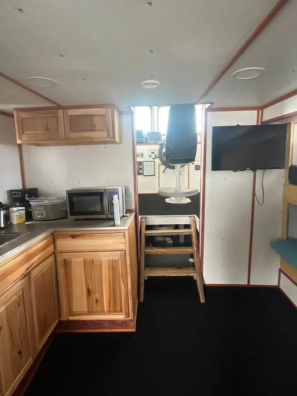 Slide: The Image of Interior of a 1978 Commercial LL Ice Trawler with kitchen and navigation area. - 11