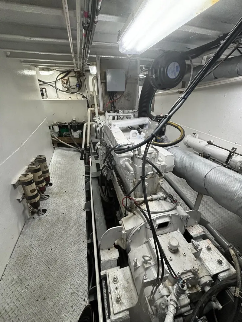 Slide: The Image of Engine room of 1978 Commercial LL Ice Trawler with visible machinery and piping. - 12