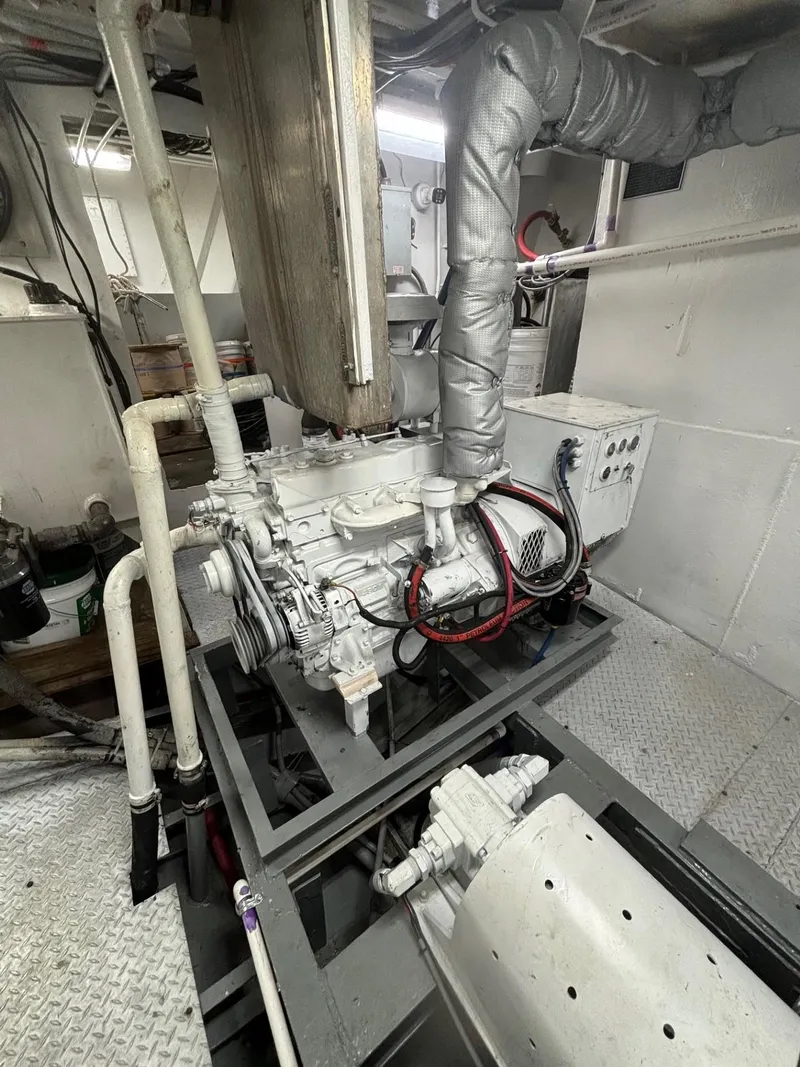 Slide: The Image of Engine room of 1978 Commercial LL Ice Trawler with visible machinery and piping. - 13