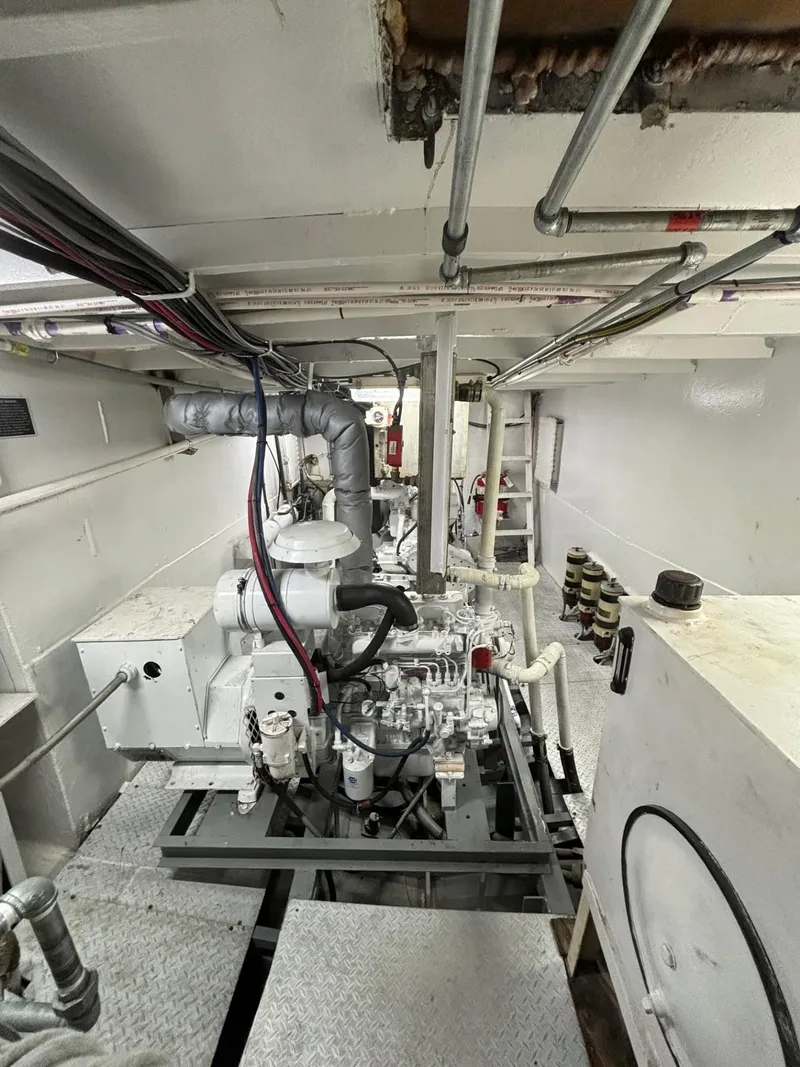 Slide: The Image of Engine room of 1978 Commercial LL Ice Trawler with visible machinery and piping. - 15