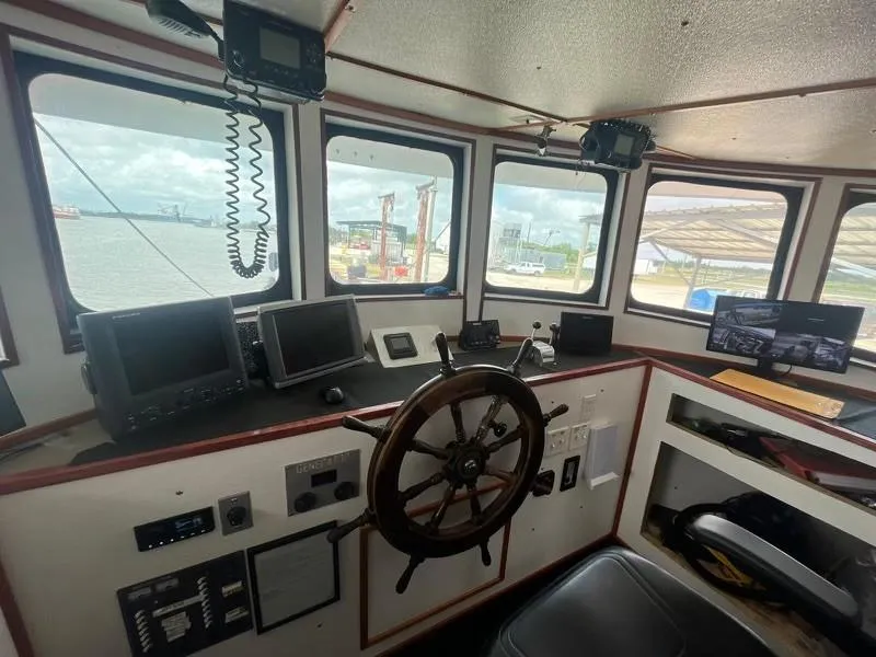 Slide: The Image of Interior of 1978 Commercial LL Ice Trawler's wheelhouse with navigation equipment and steering wheel. - 4