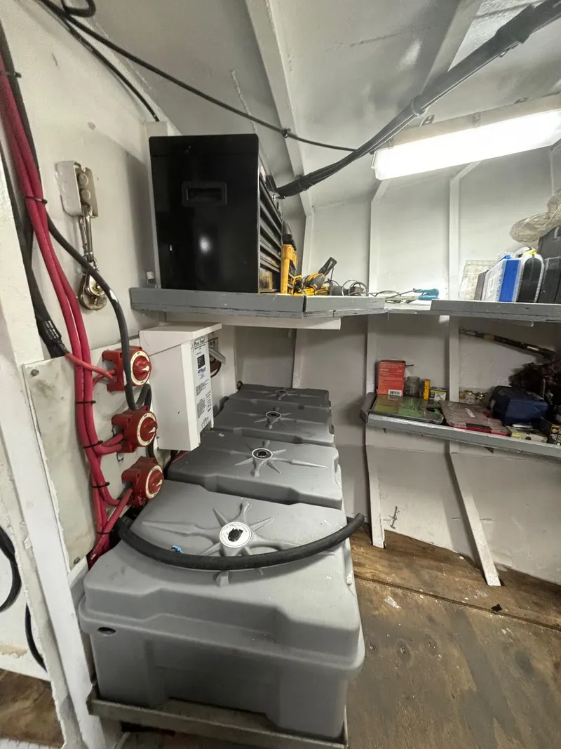 Slide: The Image of Interior of a 1978 Commercial LL Ice Trawler with equipment and storage shelves. - 9