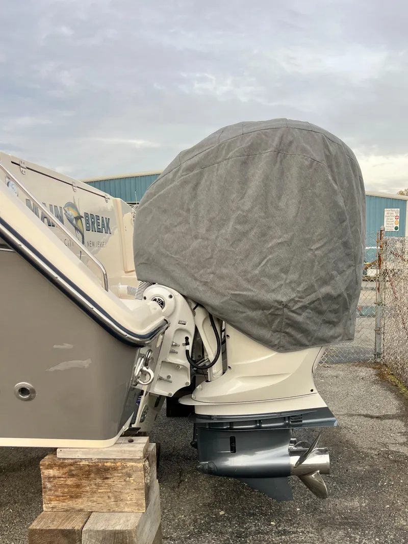Slide: The Image of 2022 Grady-White Canyon 376 boat engine covered, docked outdoors. - 14