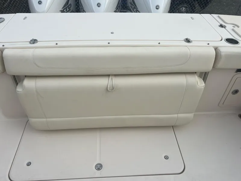 Slide: The Image of 2022 Grady-White Canyon 376 boat seat, white upholstery, sleek design. - 15