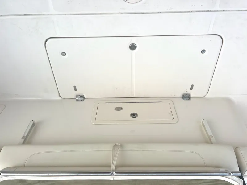 Slide: The Image of 2022 Grady-White Canyon 376 boat storage compartment, white interior view. - 18
