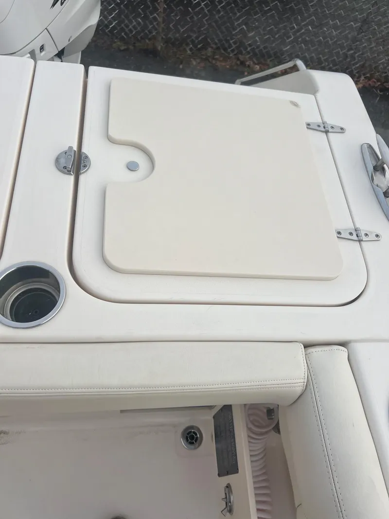 Slide: The Image of 2022 Grady-White Canyon 376 boat deck with storage compartment and cup holder. - 20