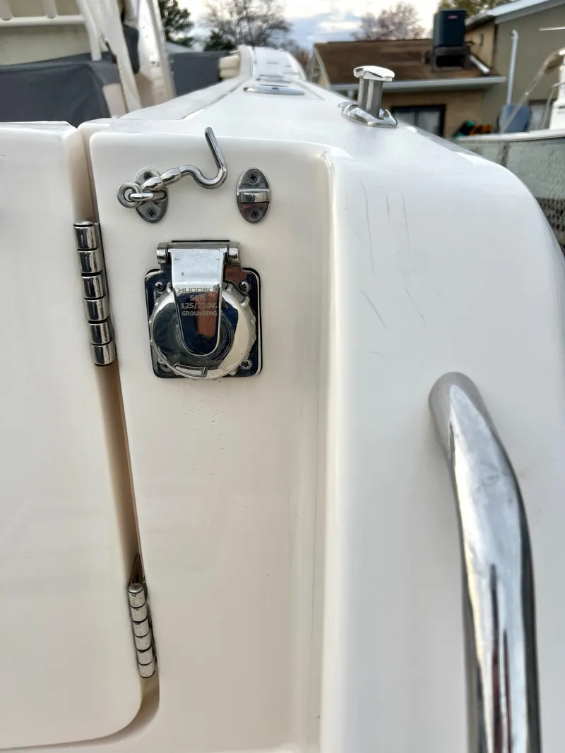 Slide: The Image of 2022 Grady-White Canyon 376 boat detail, featuring stainless steel hardware and latch. - 25