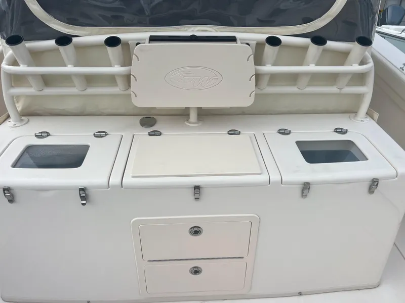 Slide: The Image of 2022 Grady-White Canyon 376 fishing station with rod holders and storage compartments. - 29