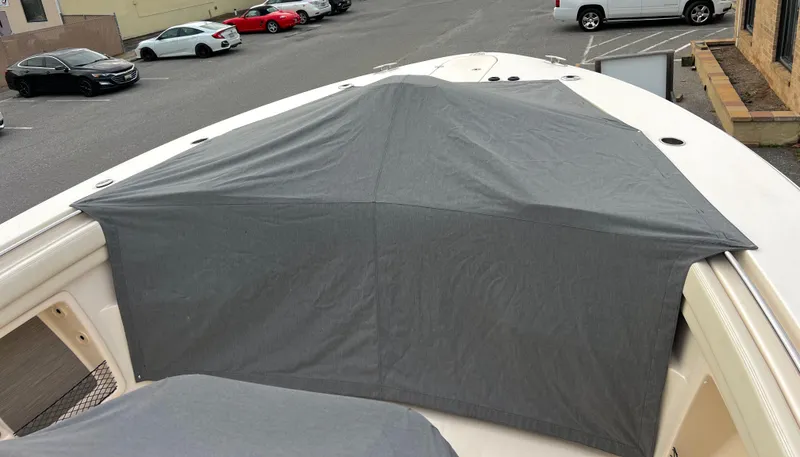 Slide: The Image of 2022 Grady-White Canyon 376 boat with gray cover in parking lot. - 33