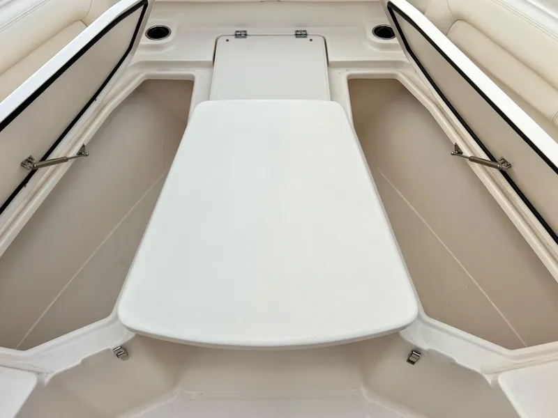 Slide: The Image of 2022 Grady-White Canyon 376 boat interior with open storage compartments. - 35
