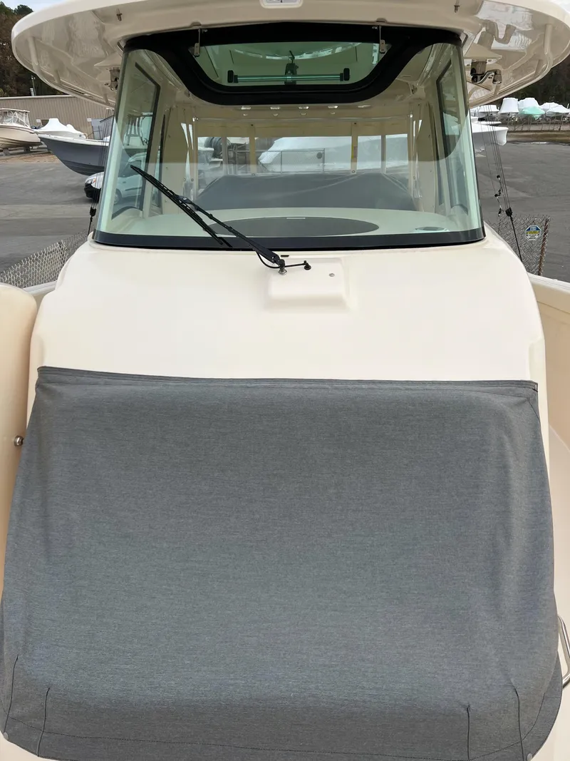 Slide: The Image of 2022 Grady-White Canyon 376 boat with covered console and windshield. - 38