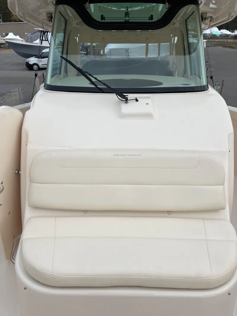 Slide: The Image of 2022 Grady-White Canyon 376 boat with cushioned seating and windshield. - 39