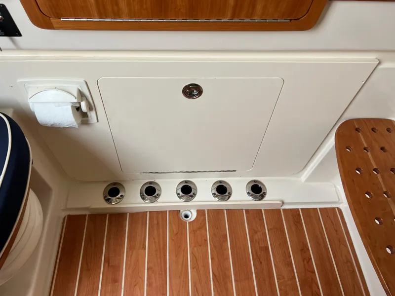 Slide: The Image of 2022 Grady-White Canyon 376 boat interior with wood flooring and storage compartment. - 42