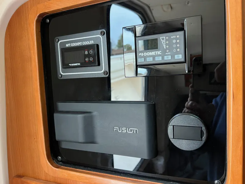 Slide: The Image of Control panel of 2022 Grady-White Canyon 376 boat with Dometic and Fusion systems. - 46