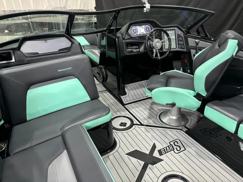 Slide: The Image of 2024 MasterCraft XStar S interior with modern design and teal accents. - 4