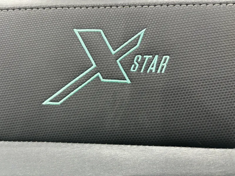 Slide: The Image of 2024 MasterCraft XStar S logo on black textured surface. - 6