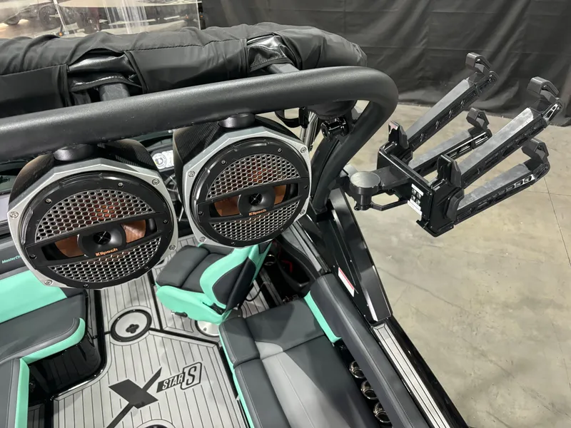 Slide: The Image of 2024 MasterCraft XStar S boat interior with speakers and wakeboard rack. - 8