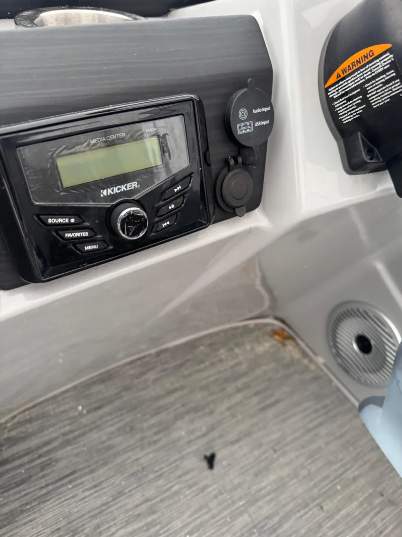 Slide: The Image of Steering console of a 2022 Bennington 23XSSB boat with Simrad display. - 4
