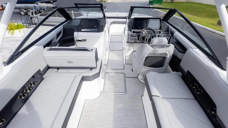 Slide: The Image of 2025 Cobalt R8 Outboard boat interior with luxurious seating and modern dashboard. - 10