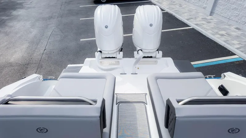 Slide: The Image of 2025 Cobalt R8 Outboard boat with dual engines, sleek design, and spacious seating. - 13