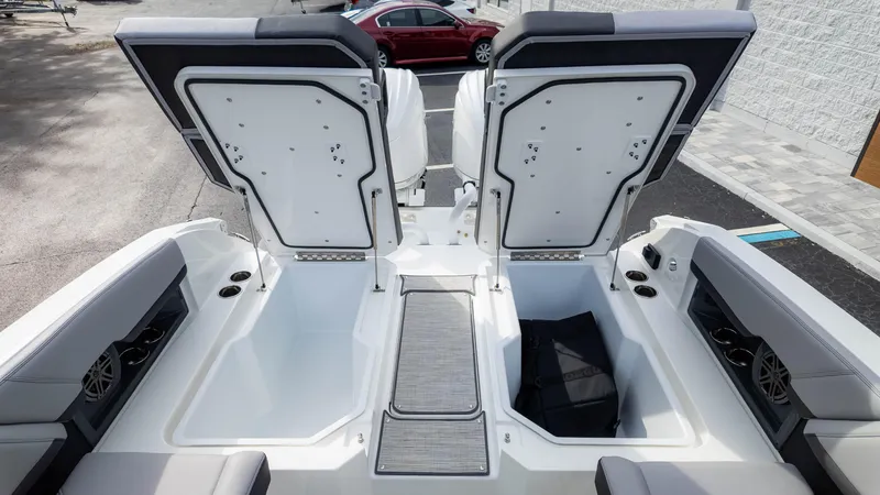 Slide: The Image of 2025 Cobalt R8 Outboard boat interior with open storage compartments. - 16