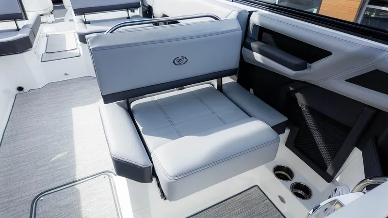 Slide: The Image of 2025 Cobalt R8 Outboard boat interior with gray seating and modern design. - 18