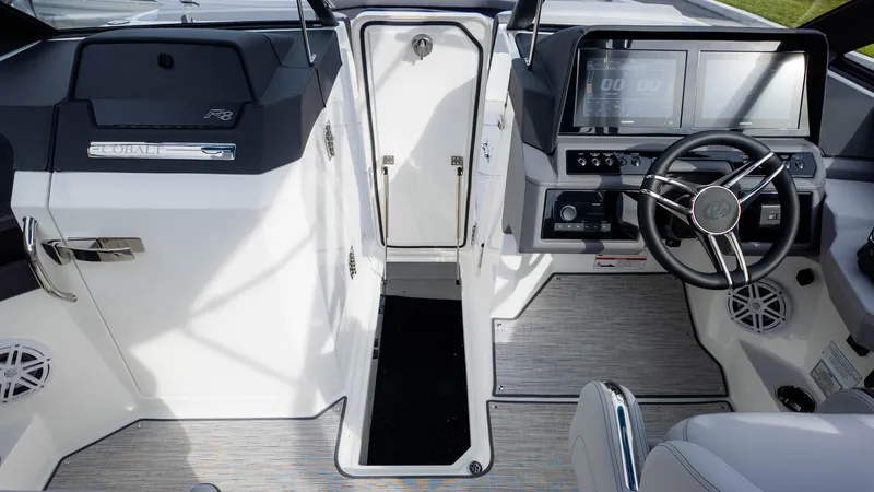 Slide: The Image of 2025 Cobalt R8 Outboard boat interior with modern dashboard and steering wheel. - 23