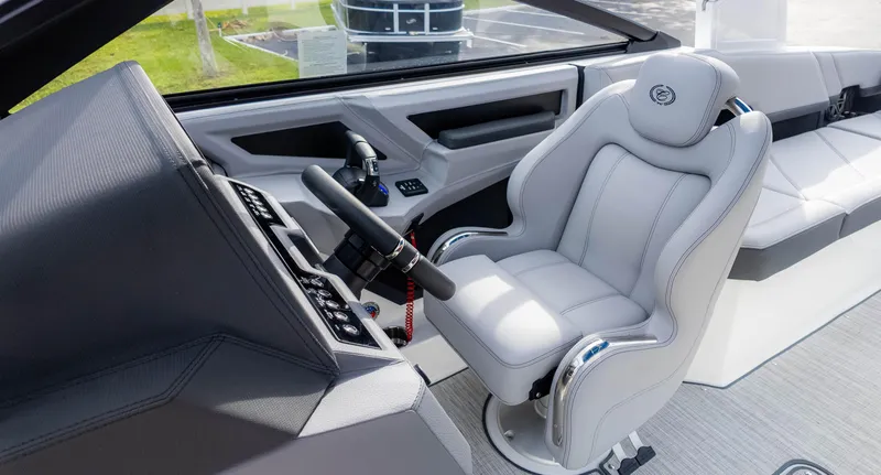 Slide: The Image of 2025 Cobalt R8 Outboard boat interior with luxurious captain's seat and modern dashboard. - 24