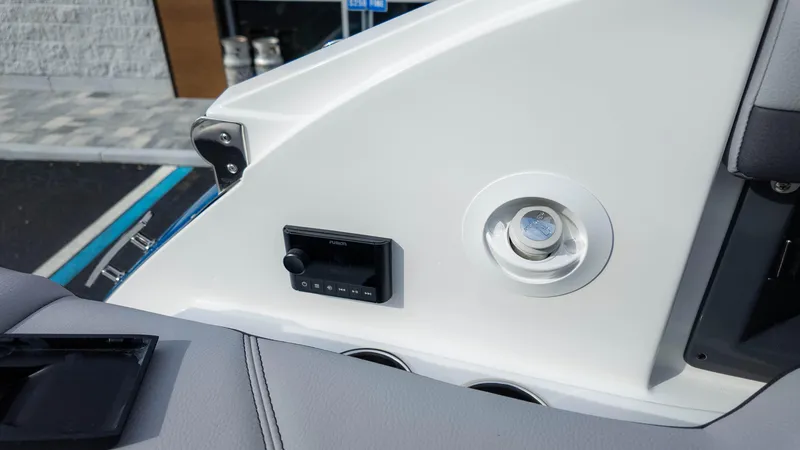 Slide: The Image of 2025 Cobalt R8 Outboard boat interior detail with control panel and speaker. - 27