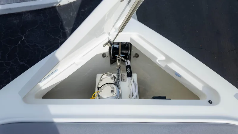 Slide: The Image of 2025 Cobalt R8 Outboard anchor compartment with open hatch. - 28