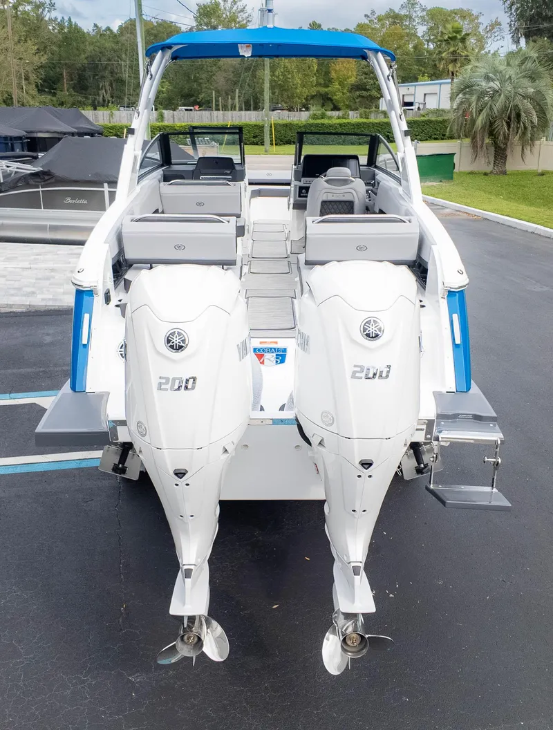 Slide: The Image of 2025 Cobalt R8 Outboard boat with dual 200 horsepower engines, rear view. - 7