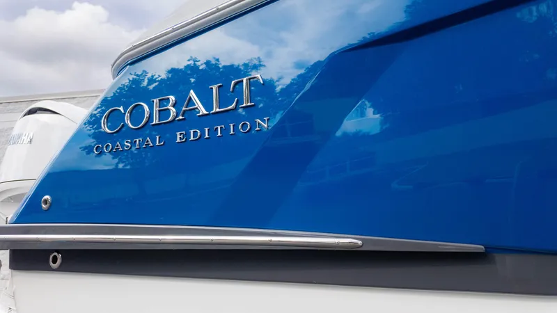 Slide: The Image of 2025 Cobalt R8 Outboard Coastal Edition boat with blue exterior. - 9