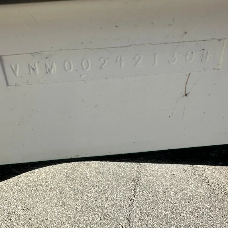 Slide: The Image of VIN number on 2004 Venture Open Fisherman boat hull. - 10