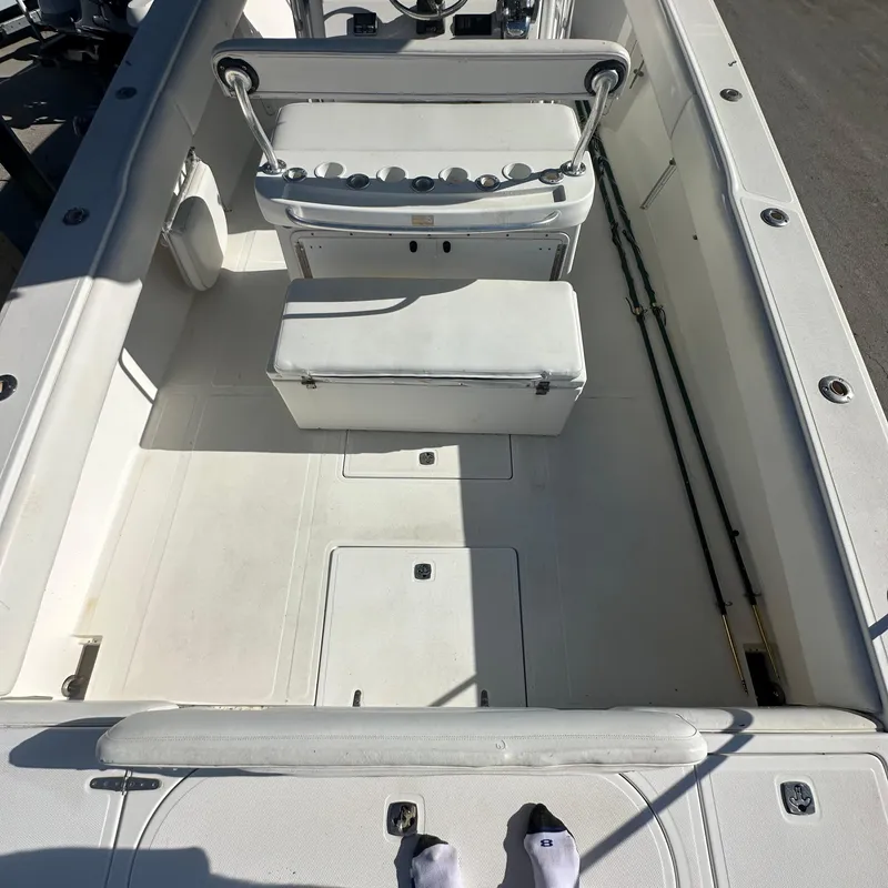 Slide: The Image of 2004 Venture Open Fisherman boat interior with seating and storage compartments. - 4
