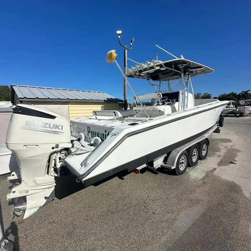 Slide: The Image of 2004 Venture Open Fisherman boat with Suzuki outboard motor on trailer. - 9