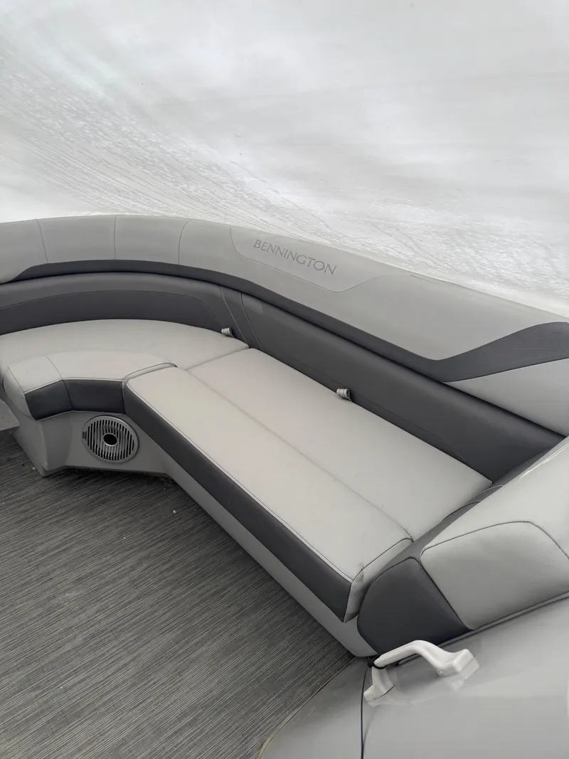 Slide: The Image of 2022 Bennington 23SXSRC pontoon boat docked with Yamaha outboard motor. - 1