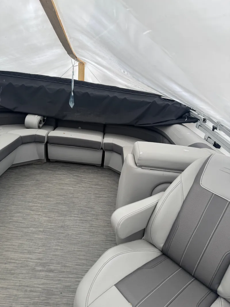 Slide: The Image of Dashboard of a 2022 Bennington 23SXSRC with Simrad display and control buttons. - 3