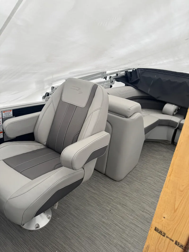 Slide: The Image of Dashboard of 2022 Bennington 23SXSRC with audio system and cup holder. - 4