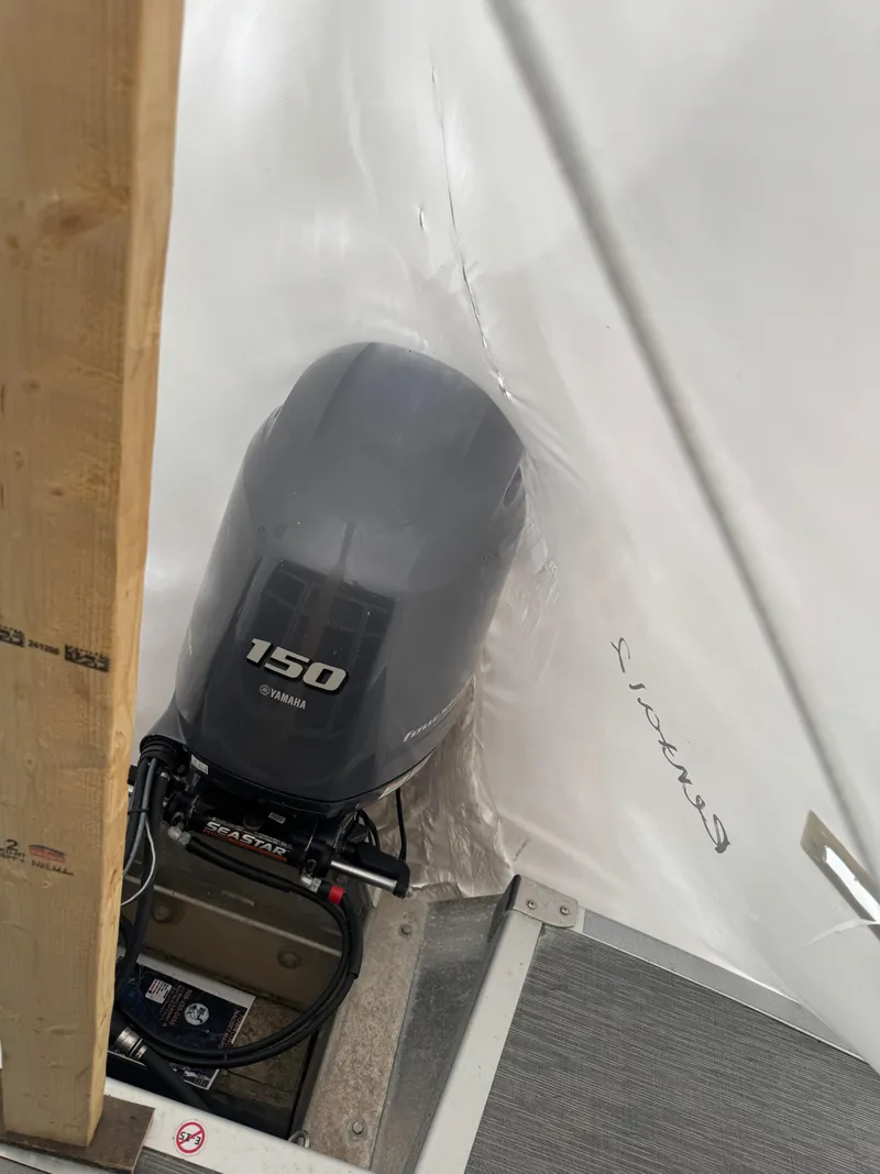 Slide: The Image of 2022 Bennington 23SXSRC pontoon boat interior with gray seating and table. - 7