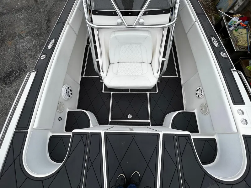 Slide: The Image of 2011 Fountain 38 CC Tournament Edition boat interior with sleek seating and modern design. - 10