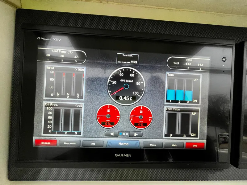 Slide: The Image of Garmin GPS display on 2011 Fountain 38 CC Tournament Edition boat, showing speed and engine metrics. - 16